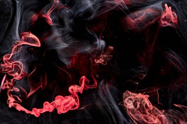 Red black abstract ocean background. Splashes and waves of paint under water, clouds of smoke in motion