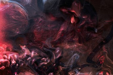 Red black abstract ocean background. Splashes and waves of paint under water, clouds of smoke in motion