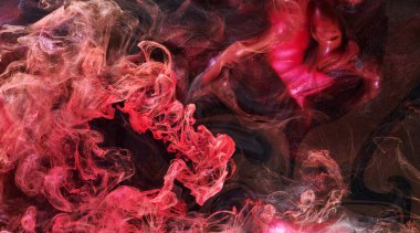 Red black abstract ocean background. Splashes and waves of paint under water, clouds of smoke in motion