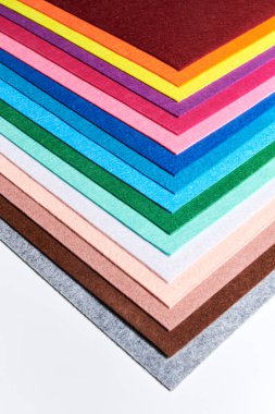 Multi-colored soft felt textile material, colorful patchwork texture fabric close-up