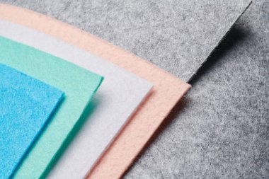 Multi-colored soft felt textile material, colorful patchwork texture fabric close-up