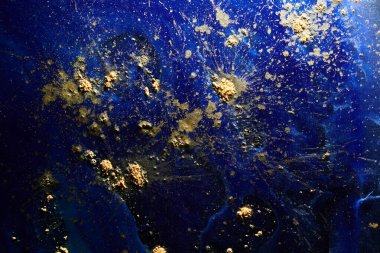 Luxury abstract background, liquid art. Blue alcohol ink with golden paint streaks, water surface, marble texture