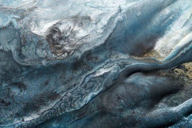 Luxury abstract background, liquid art. Blue alcohol ink with golden paint streaks, water surface, marble texture