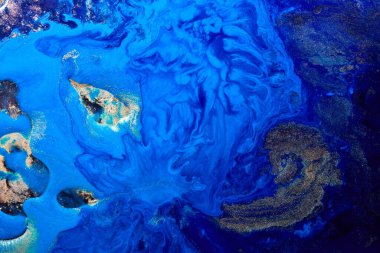 Luxury abstract background, liquid art. Blue alcohol ink with golden paint streaks, water surface, marble texture