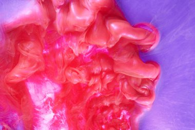 Pink lilac abstract ocean background. Splashes and waves of paint under water, clouds of interstellar smoke in motion