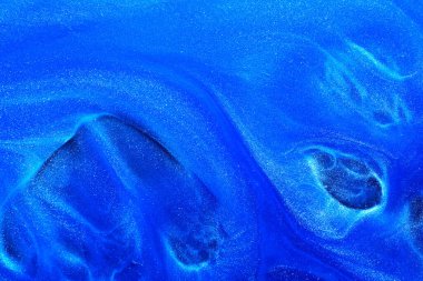 Luxury abstract background, liquid art. Blue alcohol ink with golden paint streaks, water surface, marble texture