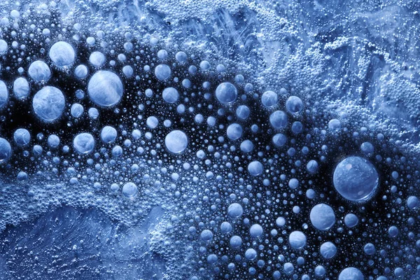 Blue bubbles abstract background. Fluid art, paints underwater