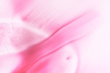 Abstract magenta background. Alcohol ink streaks and stains of wine color, paint splashes