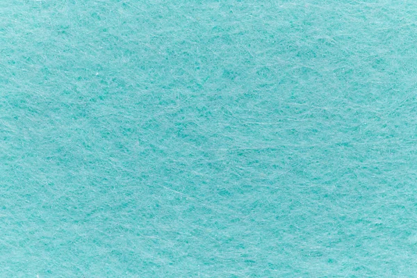 Soft felt textile material turquoise colors, colorful texture flap fabric background closeup