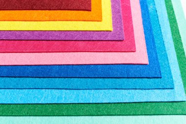 Multi-colored soft felt textile material, colorful patchwork texture fabric close-up