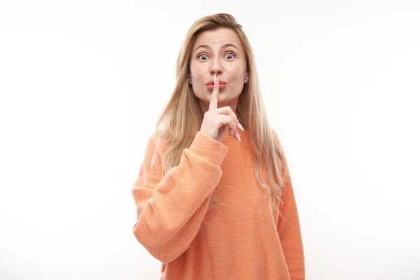 Portrait Young Blond Woman Covering Mouth Finger Isolated White Background — Stock Photo, Image