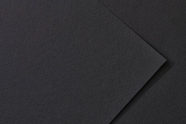 Rough kraft paper pieces background, geometric monochrome paper texture black color. Mockup with copy space for text