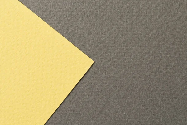 Rough kraft paper background, paper texture black yellow colors. Mockup with copy space for text