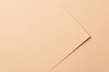Kaba Kraft kağıt parçaları arka plan, geometrik tek renkli kağıt dokusu bej rengi. Metin için kopyalama alanı olan bir model