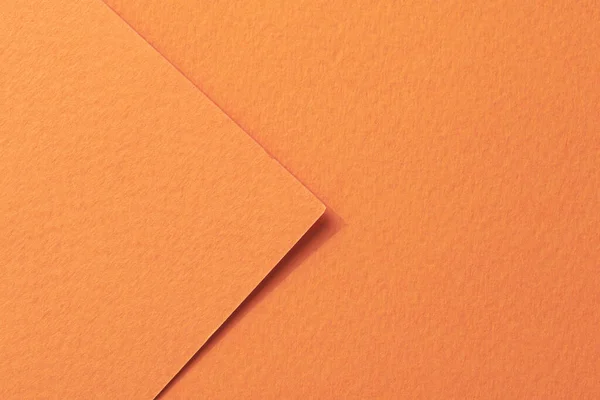 Rough kraft paper pieces background, geometric monochrome paper texture orange color. Mockup with copy space for text
