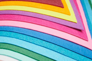 Multi-colored soft felt textile material, colorful patchwork texture fabric close-up