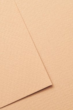 Kaba Kraft kağıt parçaları arka plan, geometrik tek renkli kağıt dokusu bej rengi. Metin için kopyalama alanı olan bir model