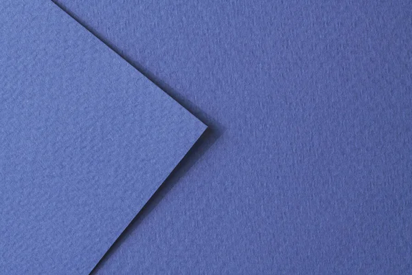 Rough kraft paper pieces background, geometric monochrome paper texture blue color. Mockup with copy space for text