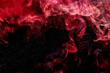 Red black abstract ocean background. Splashes and waves of paint under water, clouds of smoke in motion