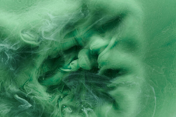 Green contrast liquid art background. Paint ink explosion, abstract clouds of smoke mock-up, watercolor underwater