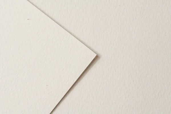 Rough kraft paper pieces background, geometric monochrome paper texture beige color. Mockup with copy space for text