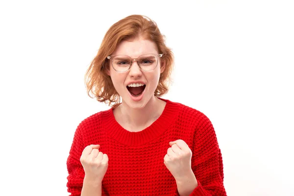 stock image Portrait angry redhead young woman screaming isolated on white studio background, showing negative emotion