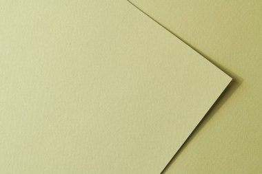 Kaba Kraft kağıt parçaları arka plan, geometrik monokrom kağıt dokusu soluk yeşil renk. Metin için kopyalama alanı olan bir model