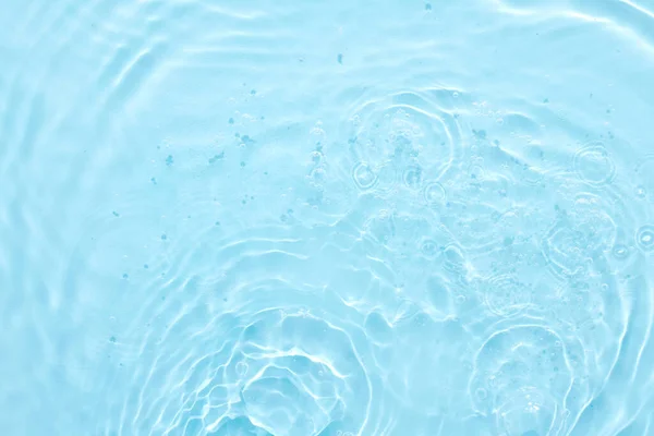 stock image Water blue surface abstract background. Waves and ripples of cosmetic moisturizer with bubbles