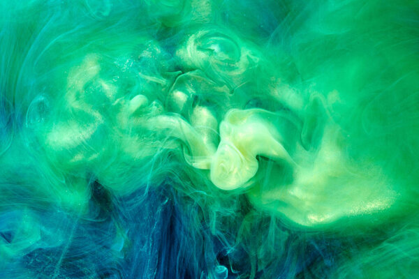 Green blue color abstract smoke background. Mix alcohol ink, creative liquid art mock-up with copy space. Acrylic paint waves underwater