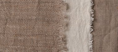 Farklı dokularda ve renklerde çarşaf. Doğal kumaşlar organik keten ve pamuktan, el yapımı tekstil. Eko, kırsal, boho, hygge dekor kapatma arkaplanı için çuval bezi ve tuval