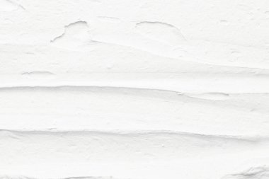 Dekoratif beyaz macun arka planı. Spatula ile doldurulmuş duvar dokusu, kaotik çizgiler ve plastın üzerine vuruşlar
