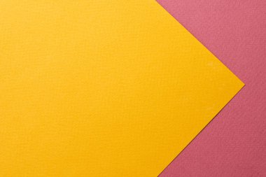 Rough kraft paper background, paper texture red burgundy yellow colors. Mockup with copy space for tex