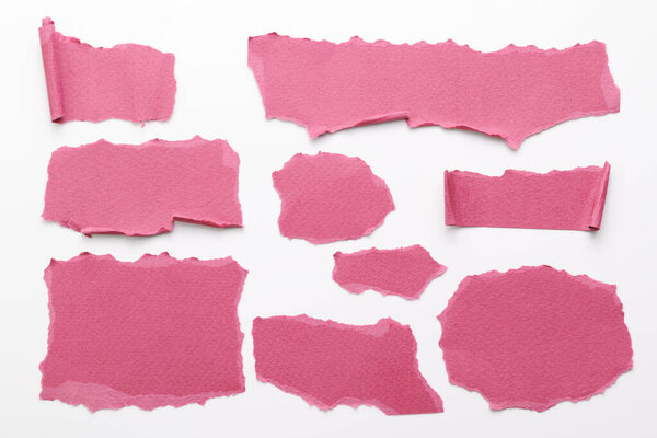 Art collage of pieces of ripped paper with torn edges. Sticky notes collection burgundy red colors, shreds of notebook pages. Abstract backgroun