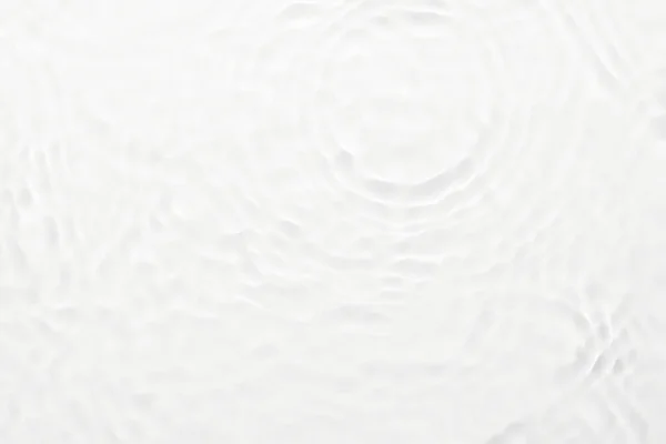 Water white surface abstract background. Waves and ripples texture of cosmetic aqua moisturizer with bubble