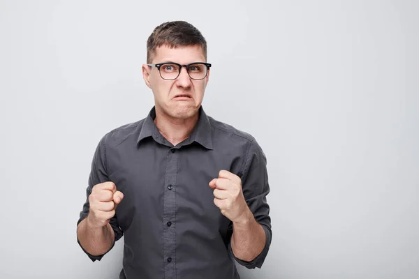 Portrait Angry Young Man Yelling Clenching Fists Isolated White Studio — Stock Photo, Image