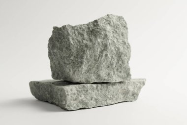 Beyaz arka planda izole edilmiş sauna taşları. Doğal mineral kaya yeşim taşı