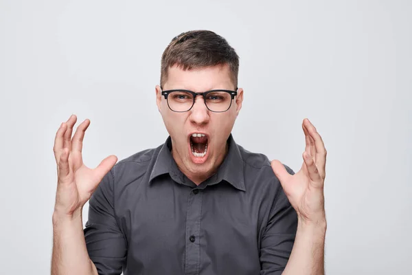 Portrait Angry Young Man Screaming Holding Hands Furious Gesture Isolated — Stock Photo, Image