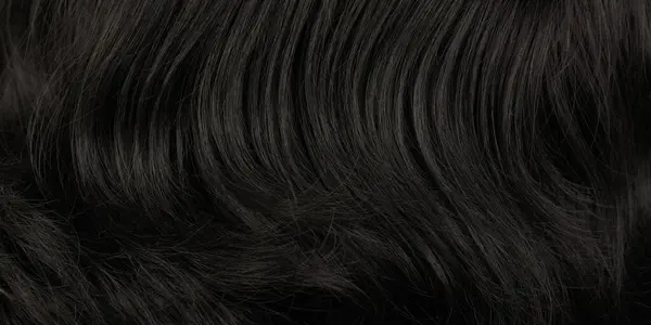 自然な光沢のあるダークヘアのクローズアップビュー ブラックブルネットカールの背景の束 — ストック写真