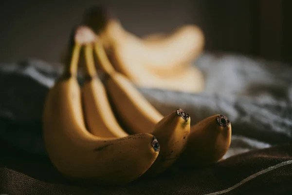 Close Bunch Bananas Dark Fabric Background — Stock Photo, Image