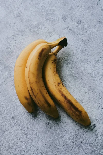 Close-up of bananas on gray textured background