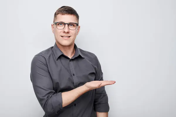 Handsome Man Glasses Holding Something Hand Demonstrating Empty Space Product — Stock Photo, Image