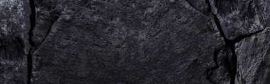 Siyah taş dokusu, koyu soyut arkaplan. Doğal mineral kaya detayları kapat, tasarım için kopya alanı olan boş arkaplan