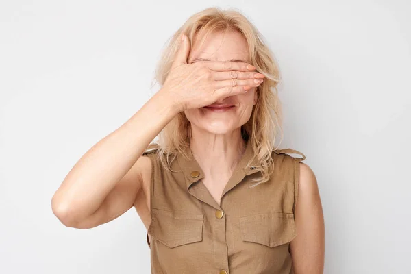 Portrait Woman Covering Eyes Hand Isolated White Studio Background — Stock Photo, Image