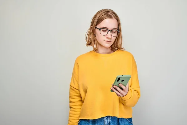 Portrait Young Blond Woman Looks Mobile Phone Thinks Person Smartphone — Stock Photo, Image
