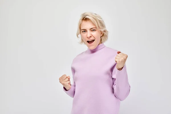 Portrait Smiling Face Blond Young Woman Clenching Fists Rejoicing Celebrating — Stock Photo, Image