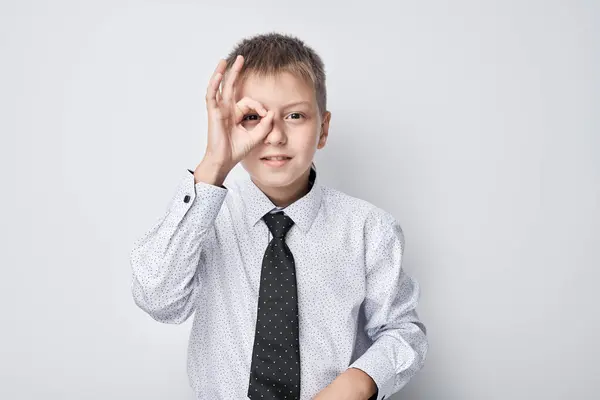 Young Boy Shirt Tie Making Gesture Eye Standing Gray Background — Stock Photo, Image