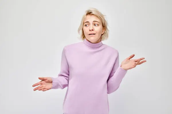 Confused Young Woman Purple Turtleneck Shrugging Hands Isolated White Background — Stock Photo, Image