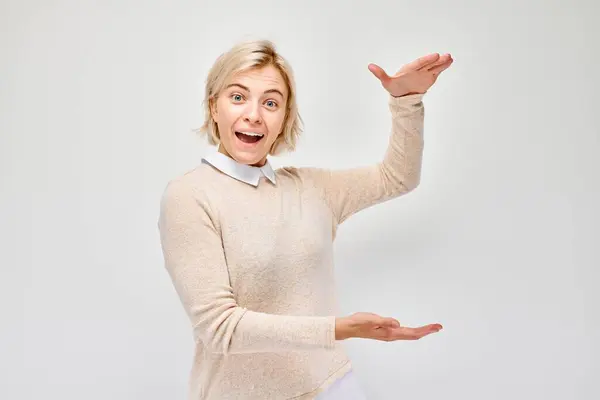 Excited Woman Gesturing Hands Showing Size White Background — Stock Photo, Image