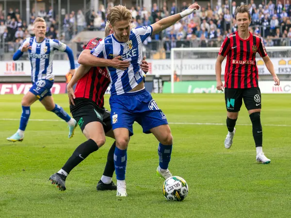 stock image September 16th, 2023: Player in Brommapojarna in attempt to steal the ball from opponent Arbnor Mucolli in IFK Gothenburg during match in round 23 of swedish football league, allsvenskan. 