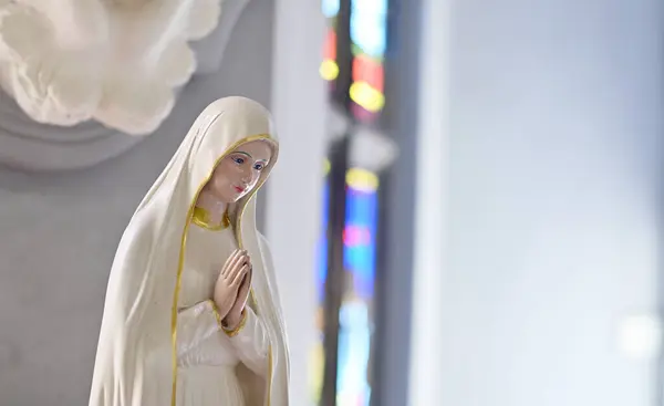 stock image Closeup of Beautiful Statue of Our lady of grace virgin Mary in the church, Thailand. selective focus.